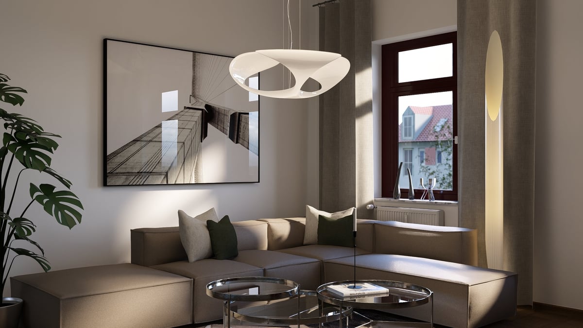 Modern living room with L-shaped beige sofa, round pendant light, framed mirror, potted plant, and city view through window